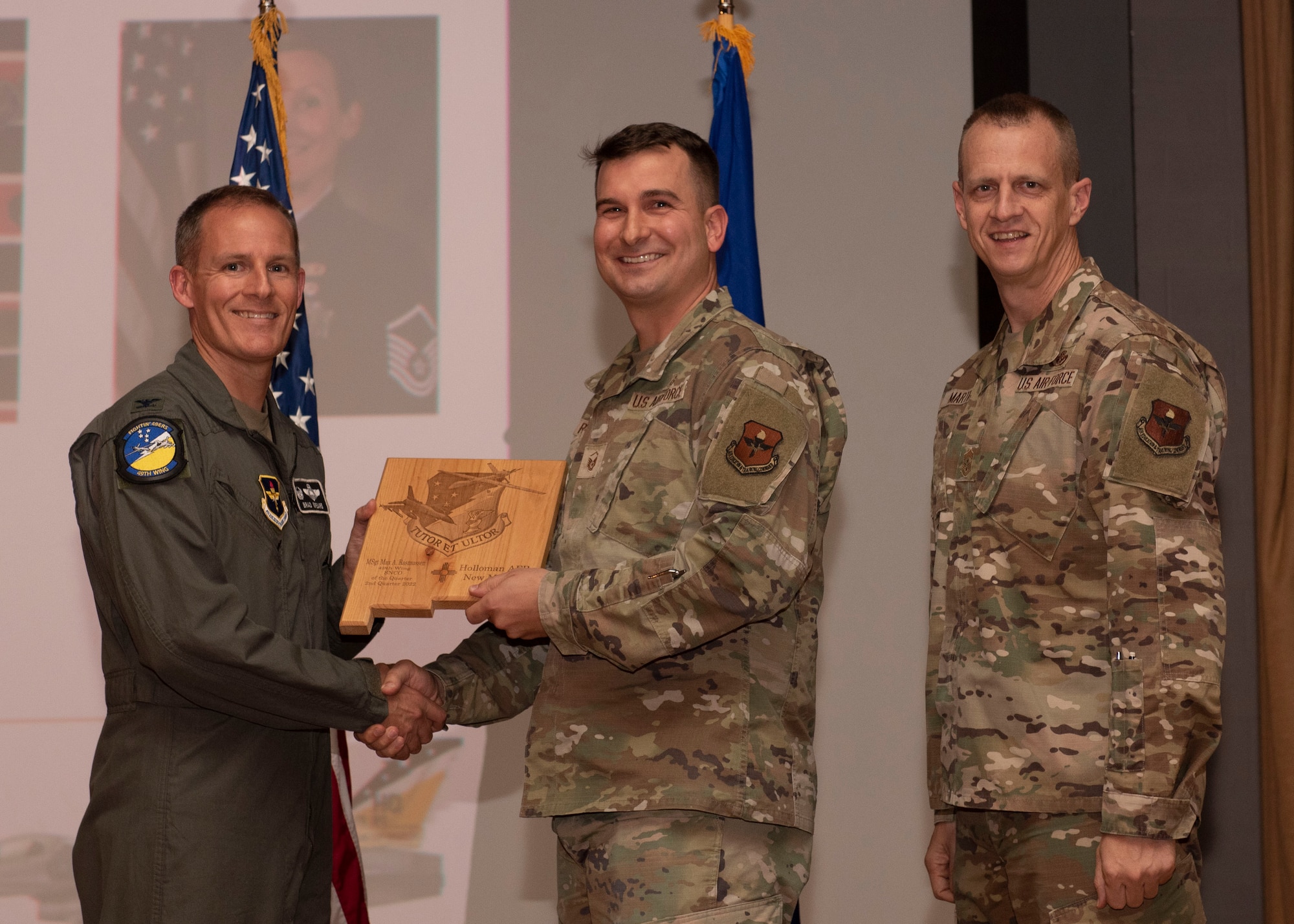 U.S. Air Force Master Sgt. Max Rasmussen accepts the Senior Non-commissioned Officer of the Quarter award during the 49th Wing’s 2nd quarter award ceremony, Aug. 29, 2022, at Holloman Air Force Base, New Mexico. Quarterly award winners were selected based on their technical expertise, demonstration of leadership and job performance. (U.S. Air Force photo by Airman 1st Class Nicholas Paczkowski)