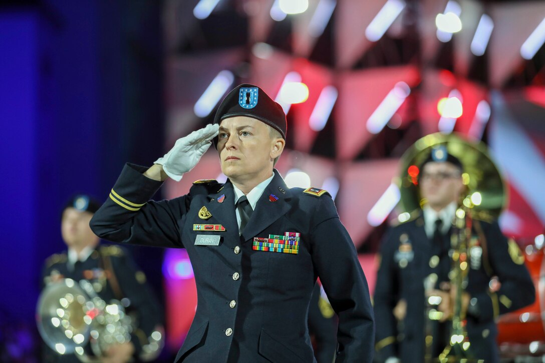 A soldier salutes during a ceremony.