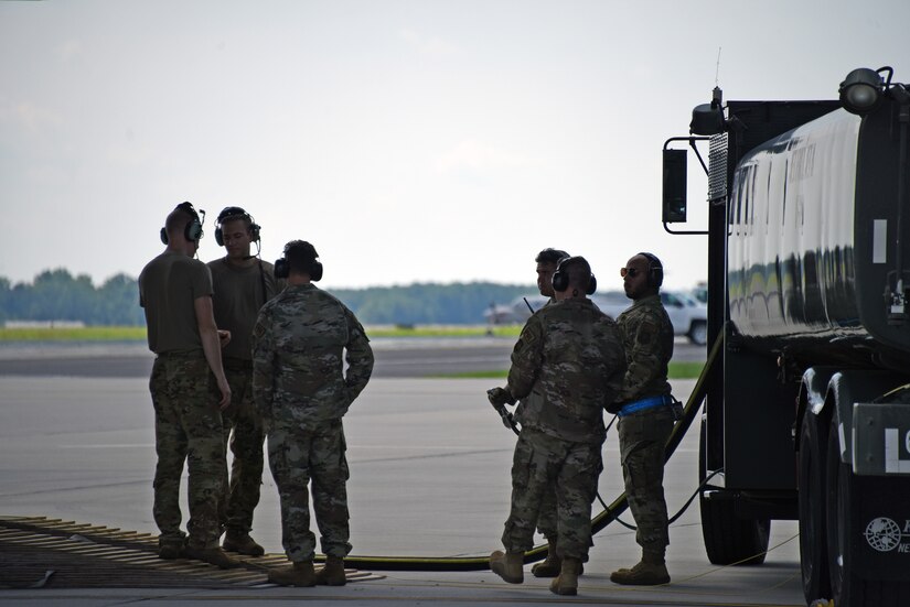 Airmen from 6th Airlift Squadron and 87th Logistics Readiness Squadron perform defuel operations from the C-17.