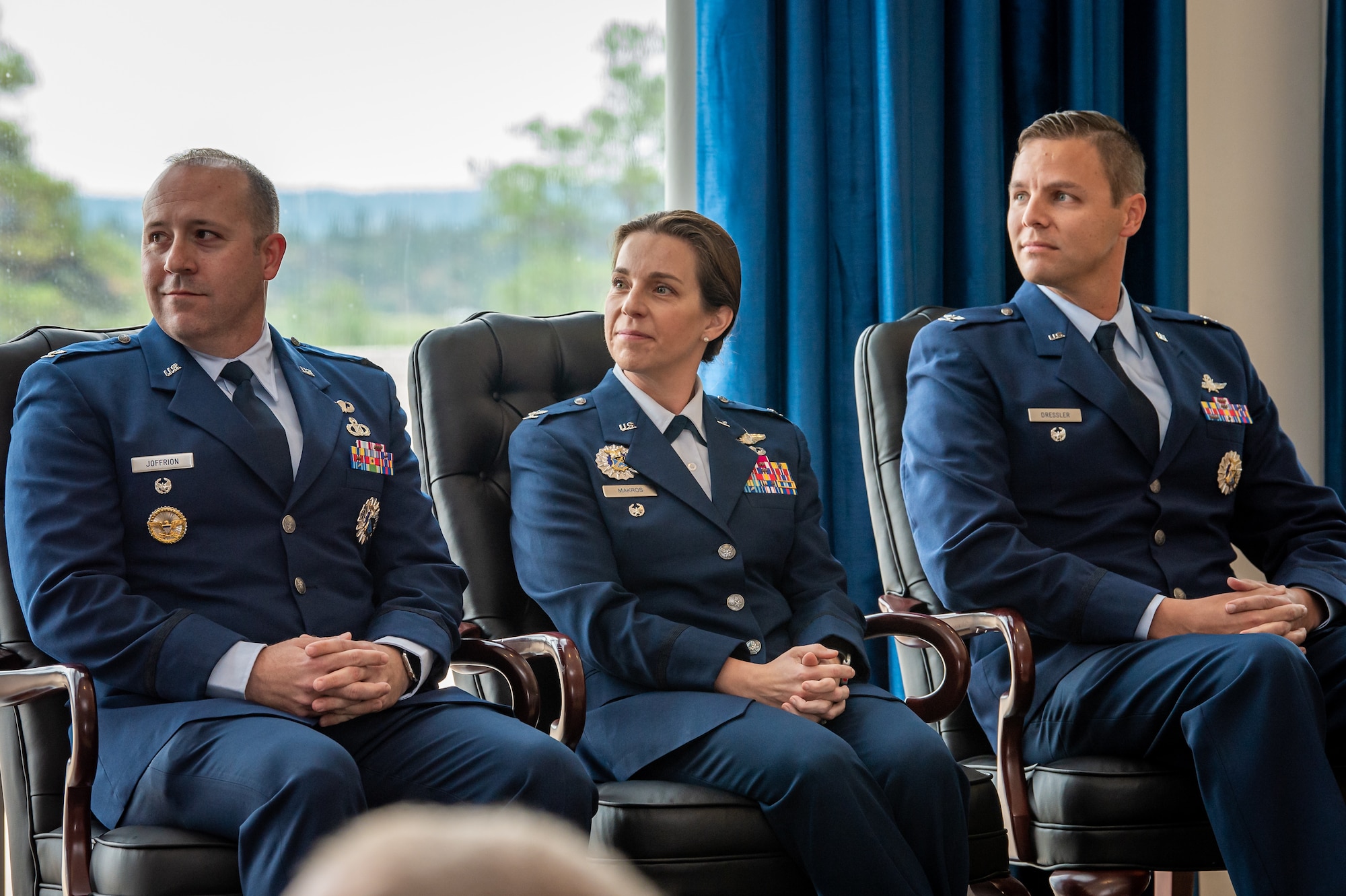 Three Air Force Academy Permanent Professors, Colonel Justin Joffrion, Colonel Beth Makros and Colonel Judson Dressler, sit during an Investiture Ceremony at Arnold Hall, U.S. Air Force Academy Colorado on August 19th 2022.
