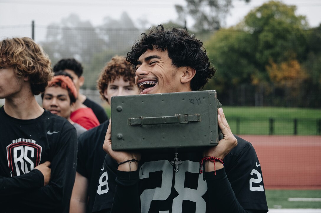 Fausto Gonzalez, a student at Harbor High School, participates in a Combat Fitness Test. (CFT)  The Marines conduct the CFT with high school students to give them insight into the physical training and discipline that is necessary to hold the Marine Corps standard.