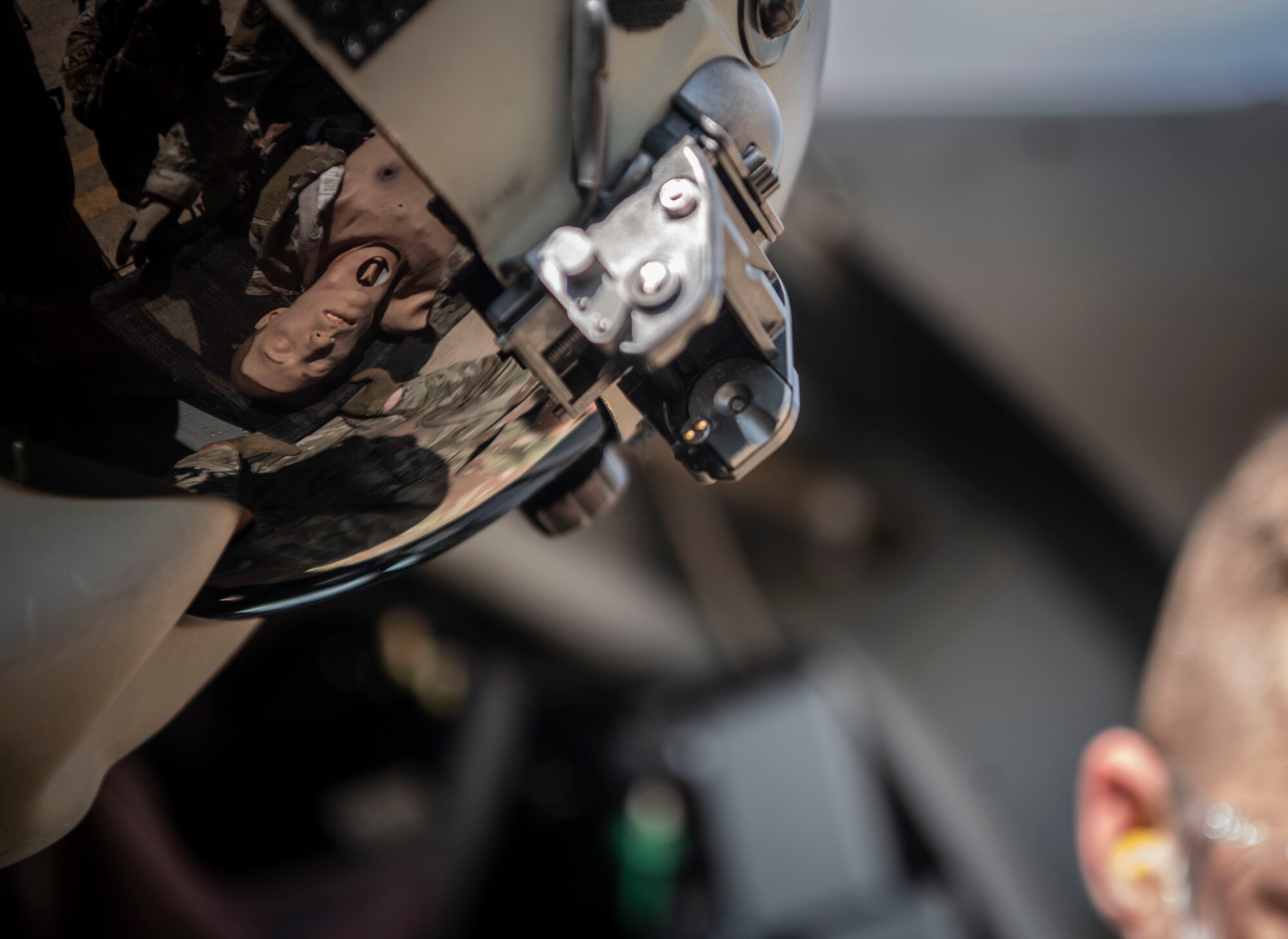 U.S. Army Sgt. Christian Martinez, 2nd Combat Aviation Brigade Charlie Company 3-2 flight crew chief, helps Airmen with the 8th Medical Group load a simulated casualty into a UH-60 Black Hawk during a training event at Kunsan Air Base, Republic of Korea, Aug. 18, 2022. The 8th MDG is devoted to optimizing the installation’s readiness in preparation of follow-on forces. (U.S. Air Force photo by Staff Sgt. Sadie Colbert)