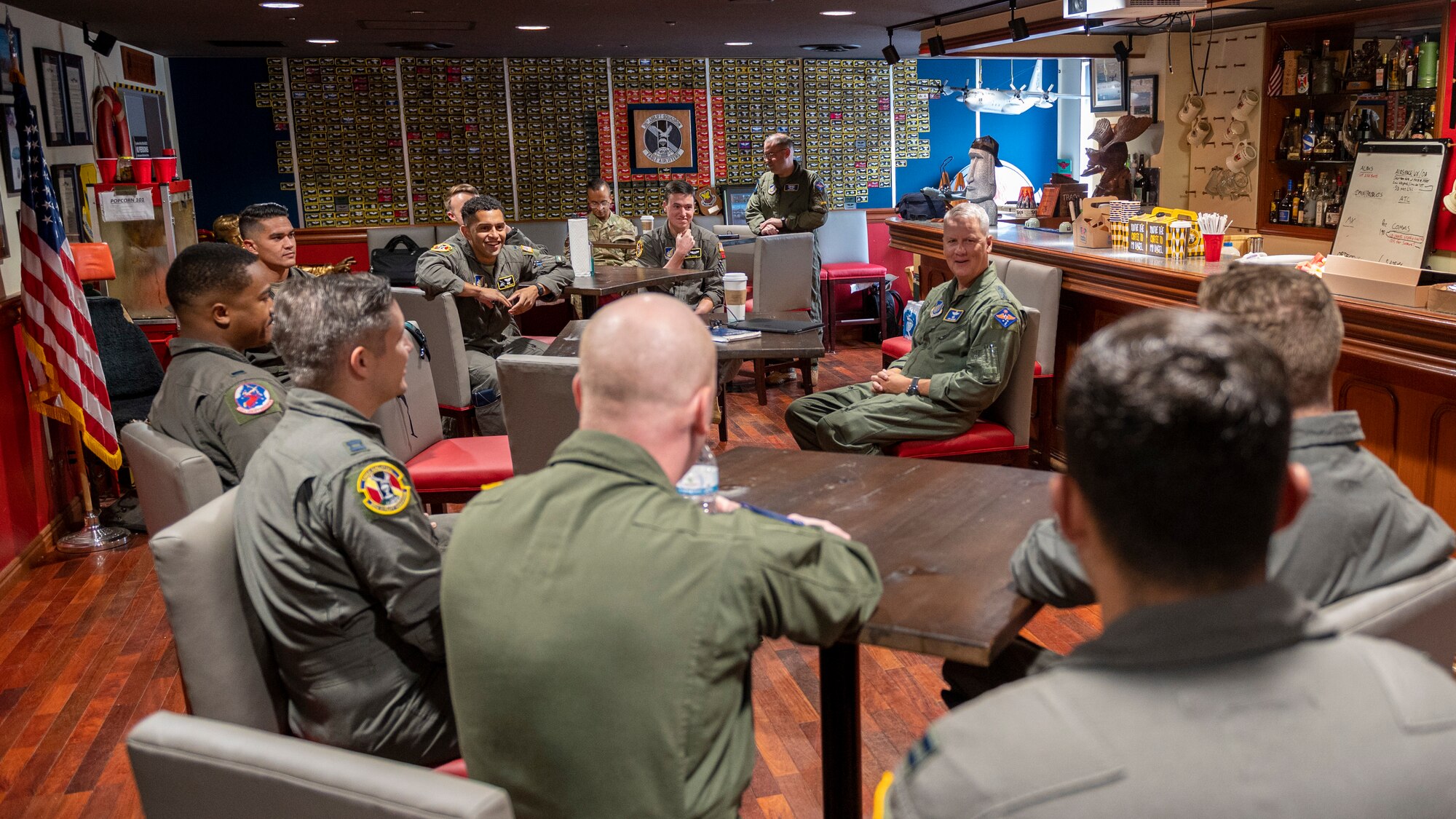 Lt. Gen James Jacobson, Pacific Air Forces deputy commander, converses with C-130J Super Hercules pilots from the 36th Airlift Squadron in the unit’s heritage room during a site tour at Yokota Air Base, Japan, Aug. 22, 2022. During the visit, Jacobson spoke to Airmen about the importance the 374th Airlift Wing’s mission. (U.S. Photo by Staff Sgt. Ryan Lackey)
