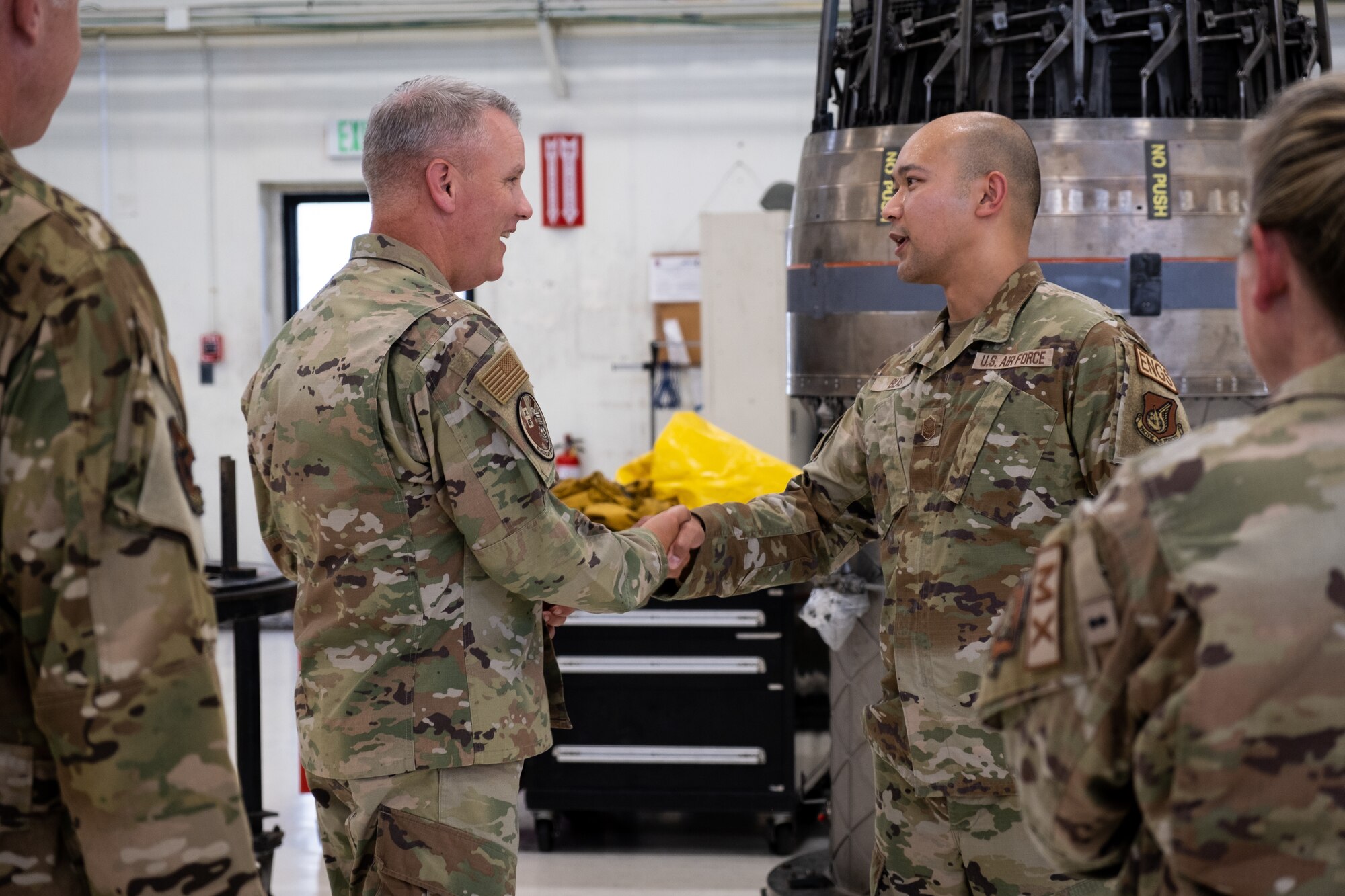 Airmen shake hands.