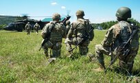Soldiers from the Headquarters and Headquarters Company, 1st Battalion, 110th Infantry Regiment, 2nd Infantry Brigade Combat Team, move to board a UH-60 Black hawk during rappel training at Fort Indiantown Gap, Pa., on August 3, 2022. The Soldiers from the 1-110th worked with the pilots and crews from the 28th Expeditionary Combat Aviation Brigade to rappel from the black hawk (U.S Army photo by Sgt. 1st Class Matthew Keeler)