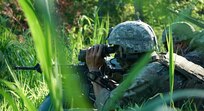 Staff Sgt. Thaisen Nguyen, a scout with the Headquarters and Headquarters Company, 1st Battalion, 110th Infantry Regiment, 2nd Infantry Brigade Combat Team, observes a location during a scouting training mission at Fort Indiantown Gap, Pa., on August 3, 2022. The scouts developed their abilities to move into an area to assess and communicate with their higher headquarters an enemy position (U.S Army photo by Sgt. 1st Class Matthew Keeler)