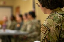An Airman listens to panelists