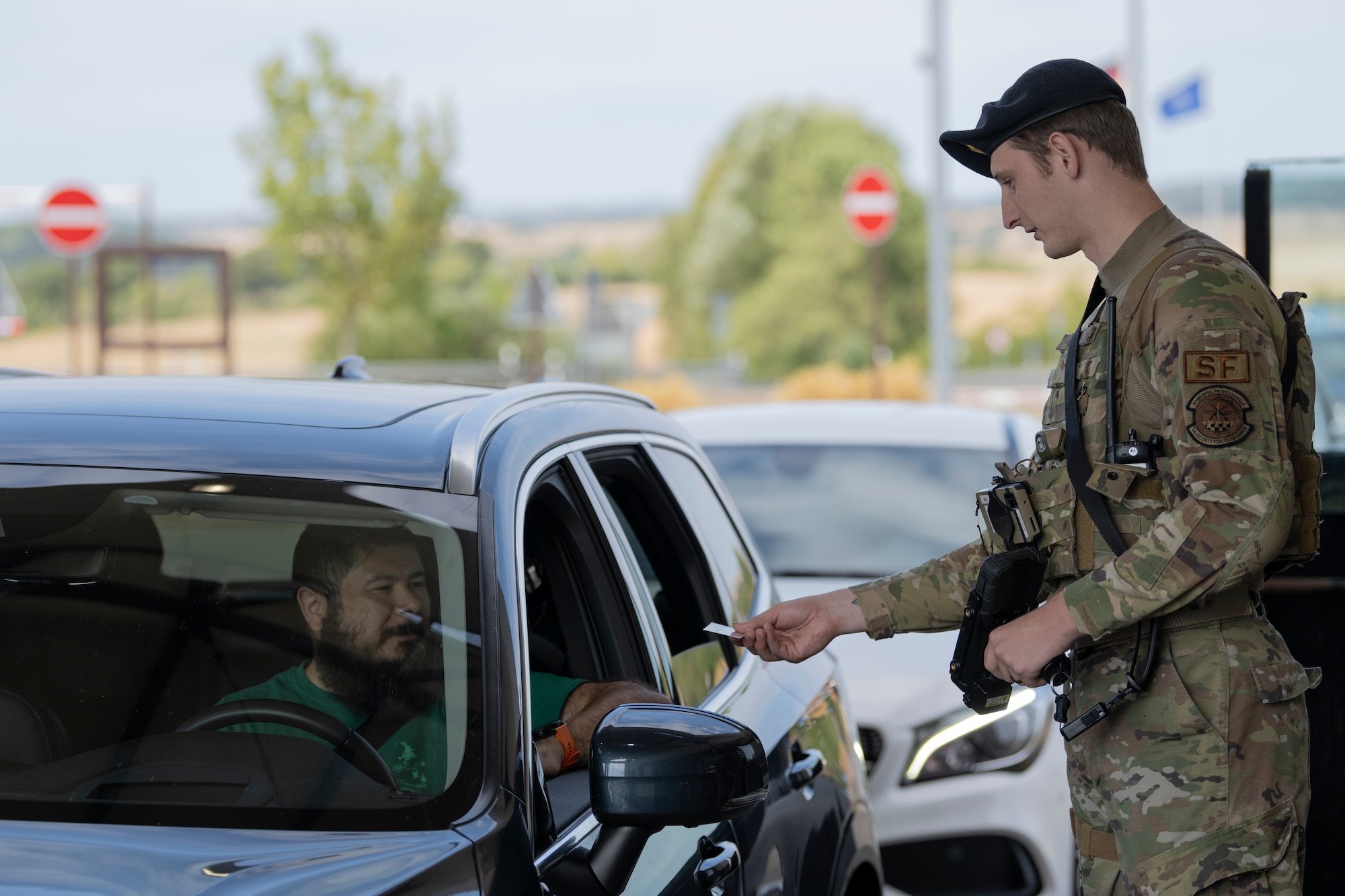 Airman checks IDs.