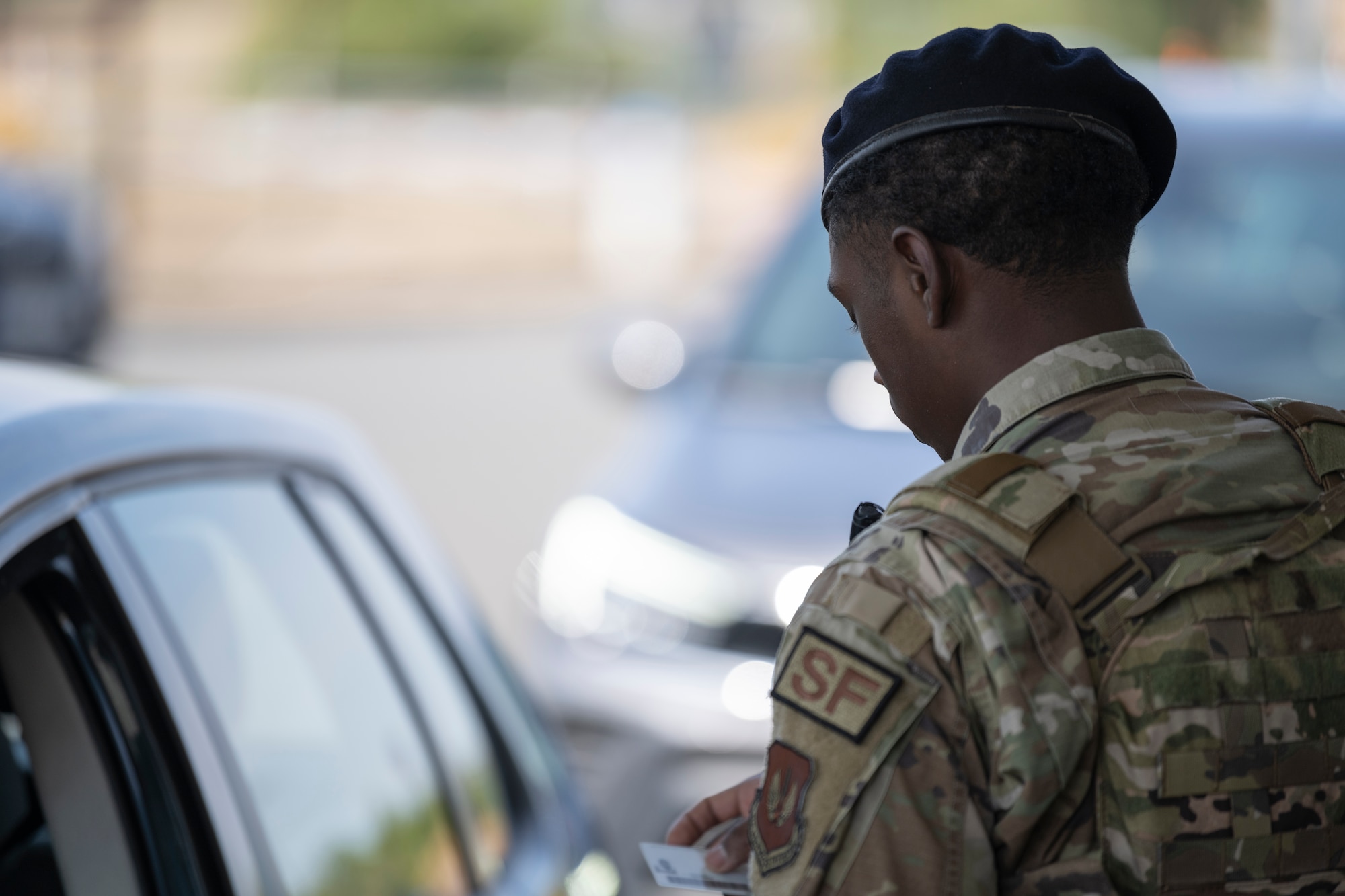 Airman checks IDs.