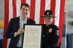 Representative Josh Harder, from California’s 10th District, presents the Congressional Record to Defense Logistics Agency Installation Management San Joaquin’ Deputy Chief of Police Daniel Harrison.