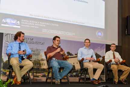 IMAGE: From left to right, Dr. Chris Wilson, Ryan Bosely, Greg Ryan and Mike Hopson discussed internal investments and advancing capabilities during the second day of Naval Surface Warfare Center Dahlgren Division’s fourth annual Modeling and Simulation Summit at the Dahlgren Campus of the University of Mary Washington.