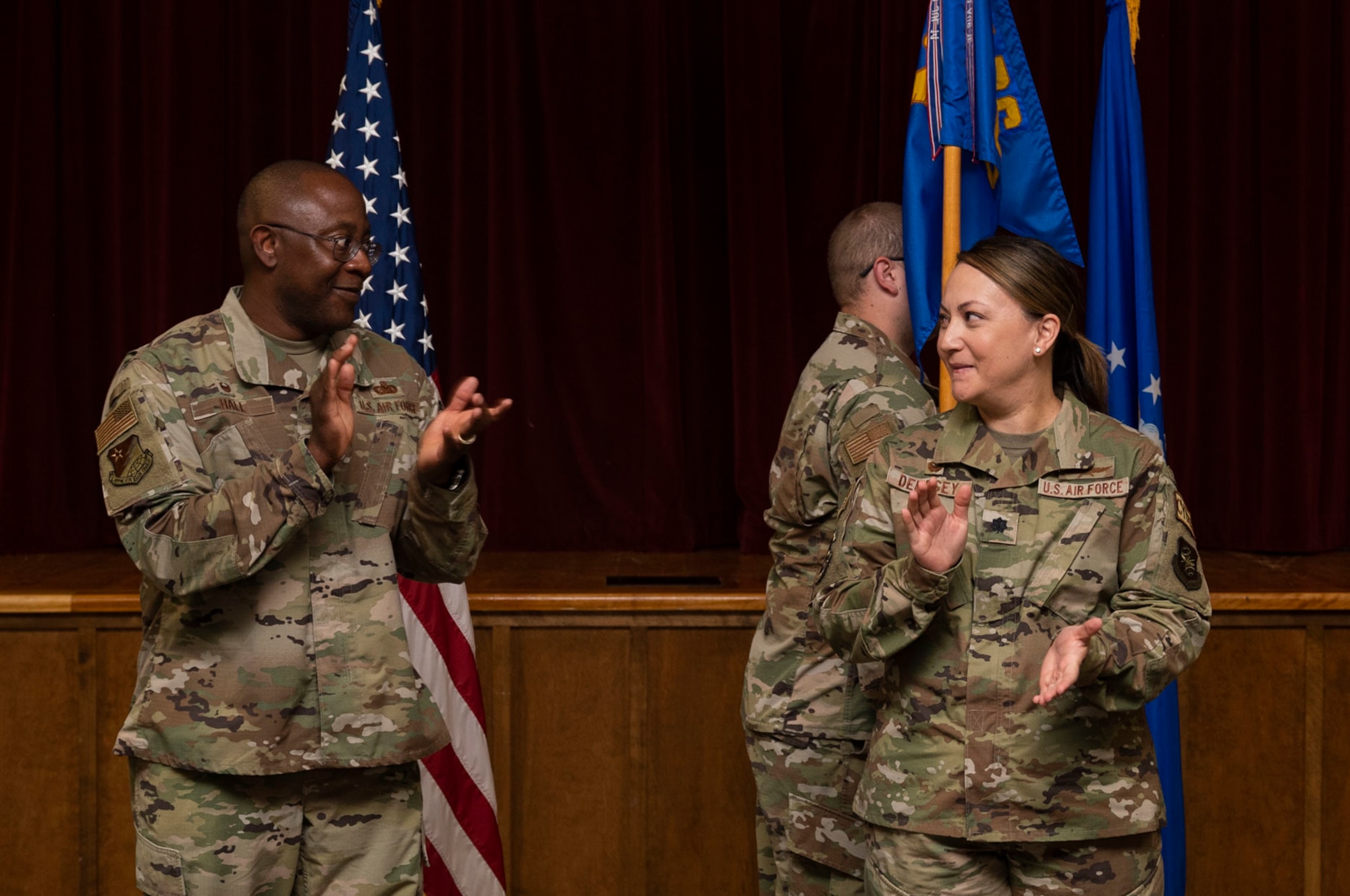 U.S. Air Force Col. Christopher Hall, left, deputy joint base commander and commander of the 627th Air Base Group, congratulates Lt. Col. Kristina Dempsey, commander of the 627th Communications Squadron, after assuming command during an assumption of command ceremony at Joint Base Lewis-McChord, Washington, Aug. 26, 2022. The 627th CS provides world-class communications support, enabling mission partner success across JBLM. (U.S. Air Force photo by Staff Sgt. Rachel Williams)