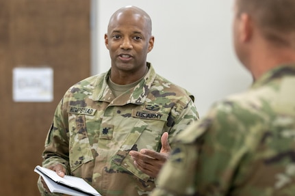 Lt. Col. Jason Hempstead, 78th Training Division Diamond Saber exercise director, briefs with Capt. Alexander Pace, 78th TD Diamond Saber exercise planner, at Joint Base McGuire-Dix, New Jersey, Aug. 12, 2022. Established in 2004, Diamond Saber is a U.S. Army Reserve-led exercise that trains and evaluates Soldiers and joint partners on warfighting functions such as funding the force, payment support, disbursing operations, accounting, fiscal stewardship, auditability and data analytics. (U.S. Army photo by Mark R. W. Orders-Woempner)