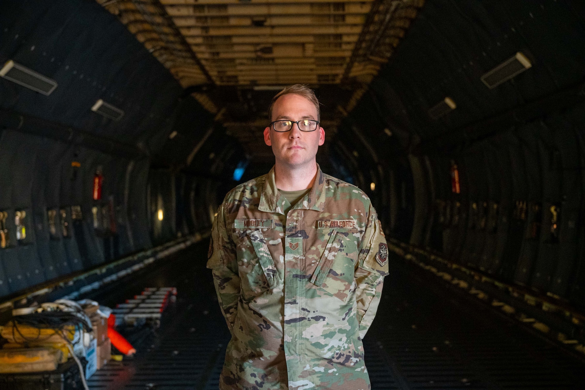 Staff Sgt. Guy Mobley, 436th Aircraft Maintenance Squadron aerospace propulsion craftsman, poses for a photo inside a C-5M Super Galaxy at Dover Air Force Base, Delaware, Aug. 31, 2022. Mobley was deployed to Al Udeid Air Base, Qatar, during Operation Allies Refuge in 2021. (U.S. Air Force photo by Senior Airman Faith Barron)