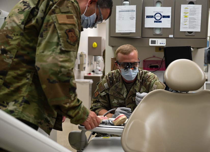 Dental resident working with professor at JBLE.