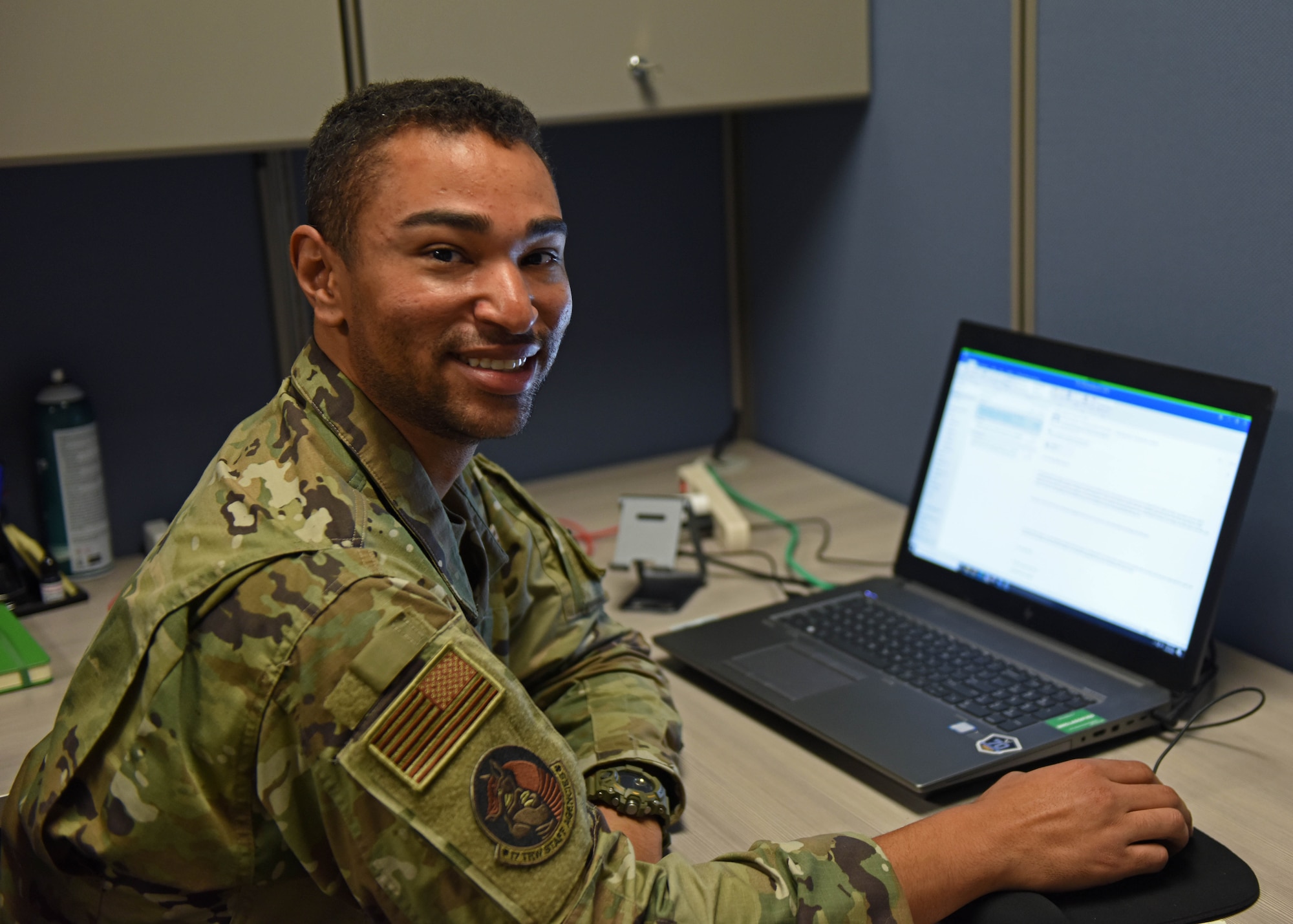 U.S. Air Force Tech. Sgt. Skott Cameron, 17th Comptroller Squadron noncommissioned officer in charge of financial operations, poses for a photo at his desk at Goodfellow Air Force Base, Texas, Aug. 16, 2022. Cameron oversees the processing of payments, travel vouchers, and permanent change of station forms across the 17th Training Wing. (U.S. Air Force photo by Airman 1st Class Sarah Williams)