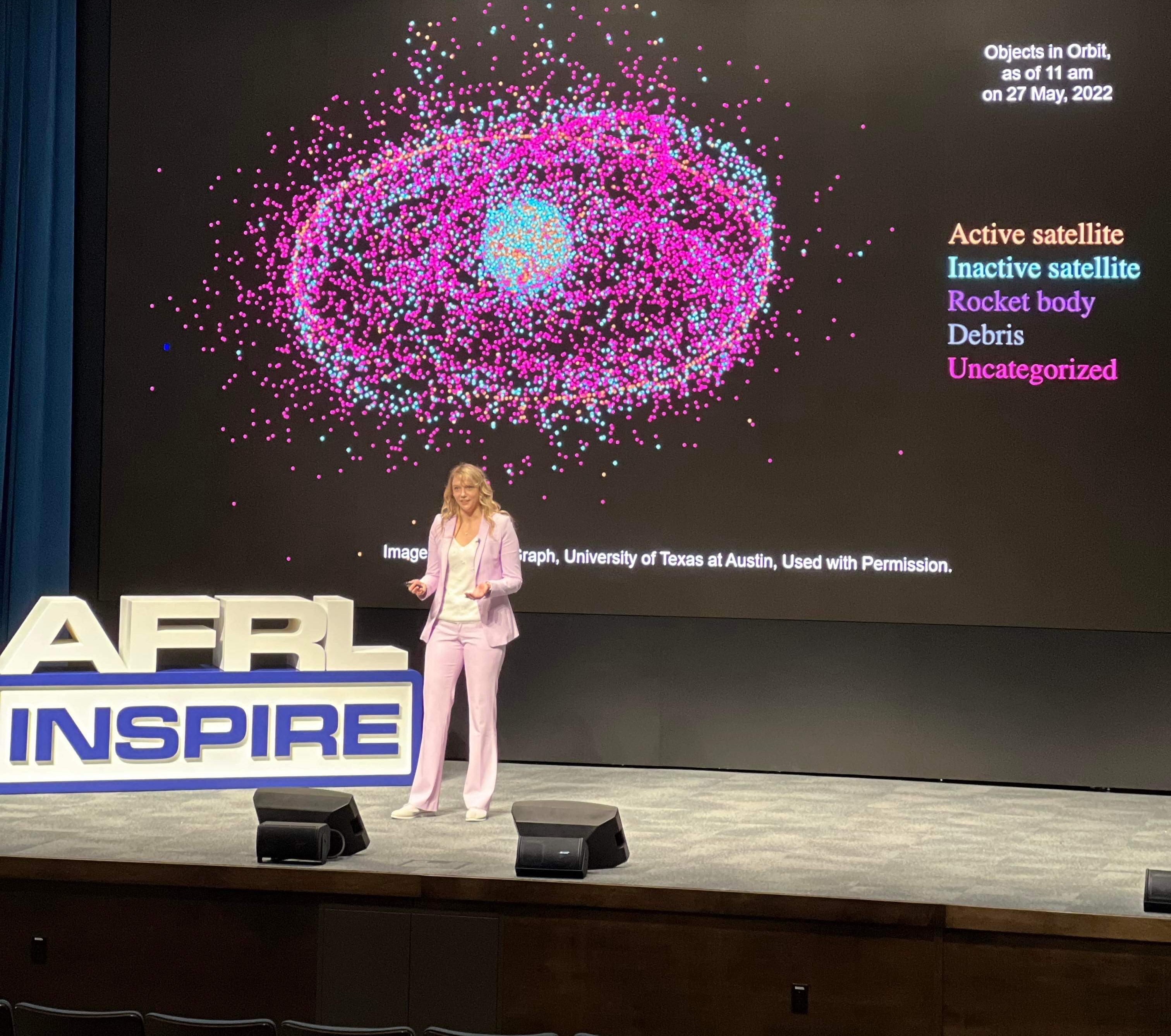 Dr. Kerianne Hobbs, a research aerospace engineer and the ACT3 safe autonomy and space lead from the Air Force Research Laboratory’s Sensors Directorate, highlighted  her work training artificial intelligence systems to safely and autonomously navigate spacecraft during AFRL Inspire. AFRL hosted this special TEDx-style event at the Air Force Institute of Technology's Kenney Hall at Wright-Patterson Air Force Base, Aug. 23, 2022. (U.S. Air Force photo / Shelley St. Augustine)