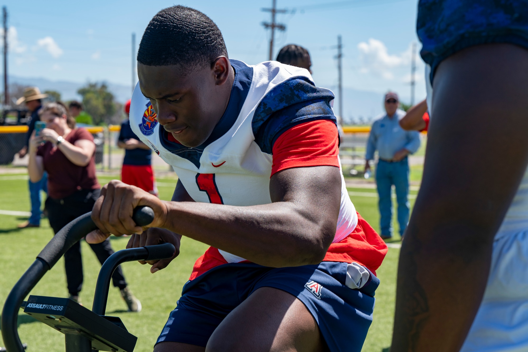 UofA player works out on an exercise bike