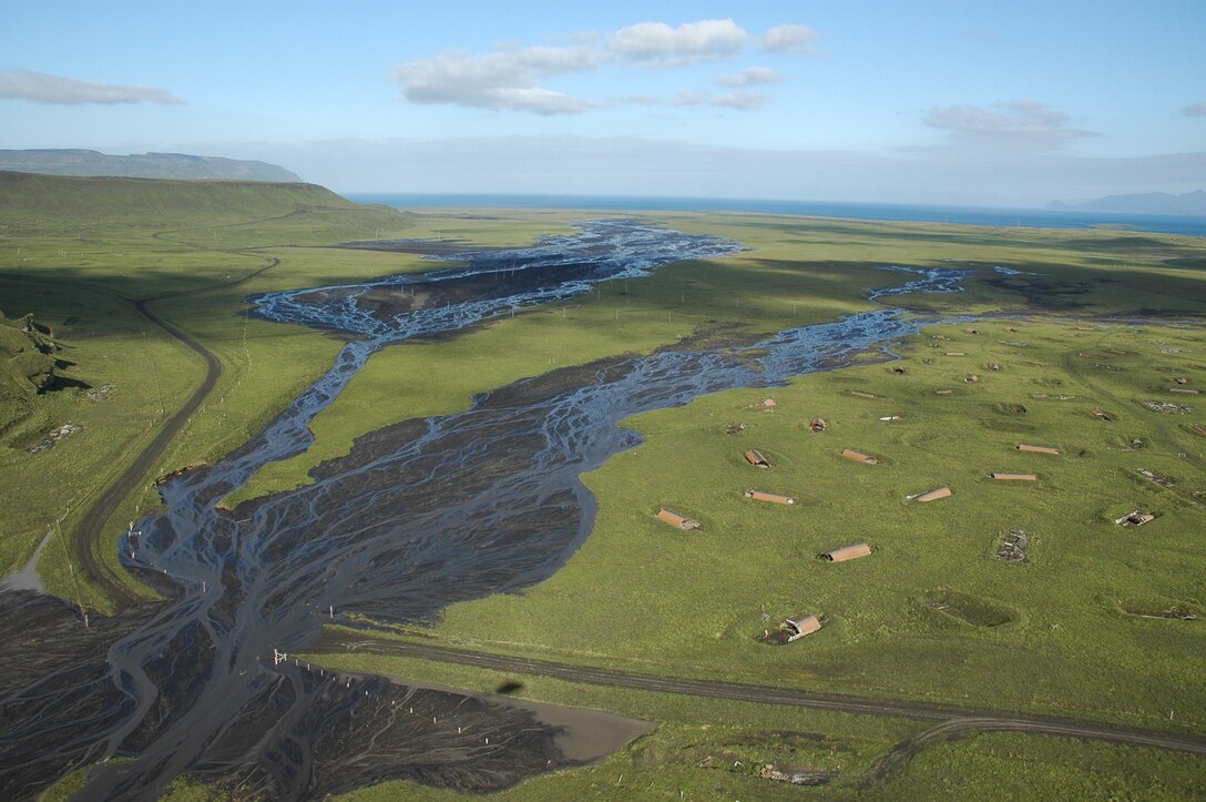 In 2008, the eruption of Mount Okmok generated a volcanic mudflow that covered a 70-acre portion of the Fort Glenn Formerly Used Defense Site on Umnak Island in Alaska. A field crew for the U.S. Army Corps of Engineers found that this lahar layer varied in depth from a few inches to as much as 4 feet in some areas during the process of removing unexploded ordnance from the site in 2020 and 2021. This issue required the team to excavate wider and deeper to ensure all munitions were safely recovered from the soil. (U.S. Army Photo)