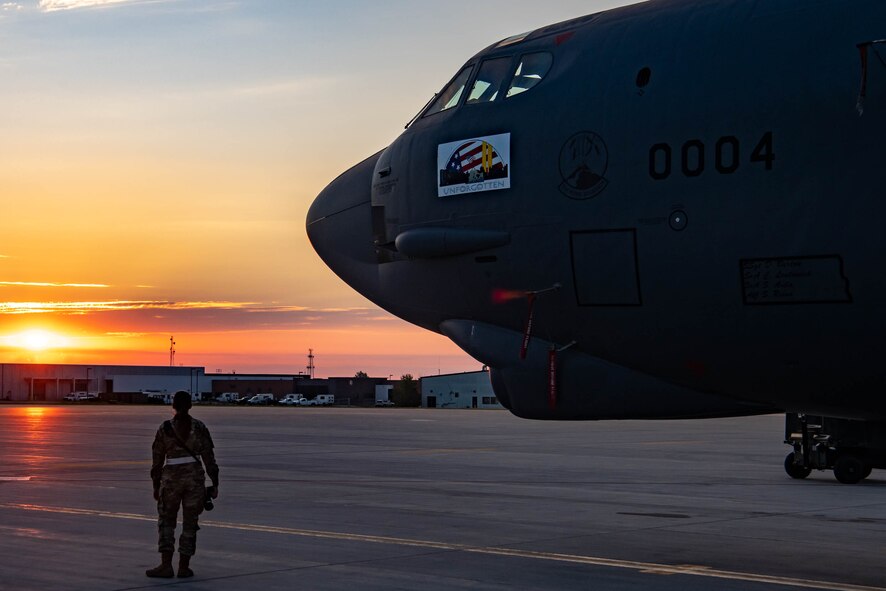 Airman Alysa Knott, 5th Bomb Wing Public Affairs Apprentice, takes photos of a B-52H park at the Main Parking Apron at Minot Air Force Base, North Dakota, Aug. 23, 2022. Public Affairs professionals are responsible for telling Air Force stories that help facilitate the free flow of communication between the Air Force and the public. (U.S. Air Force photo by Airman 1st Class Alexander Nottingham)