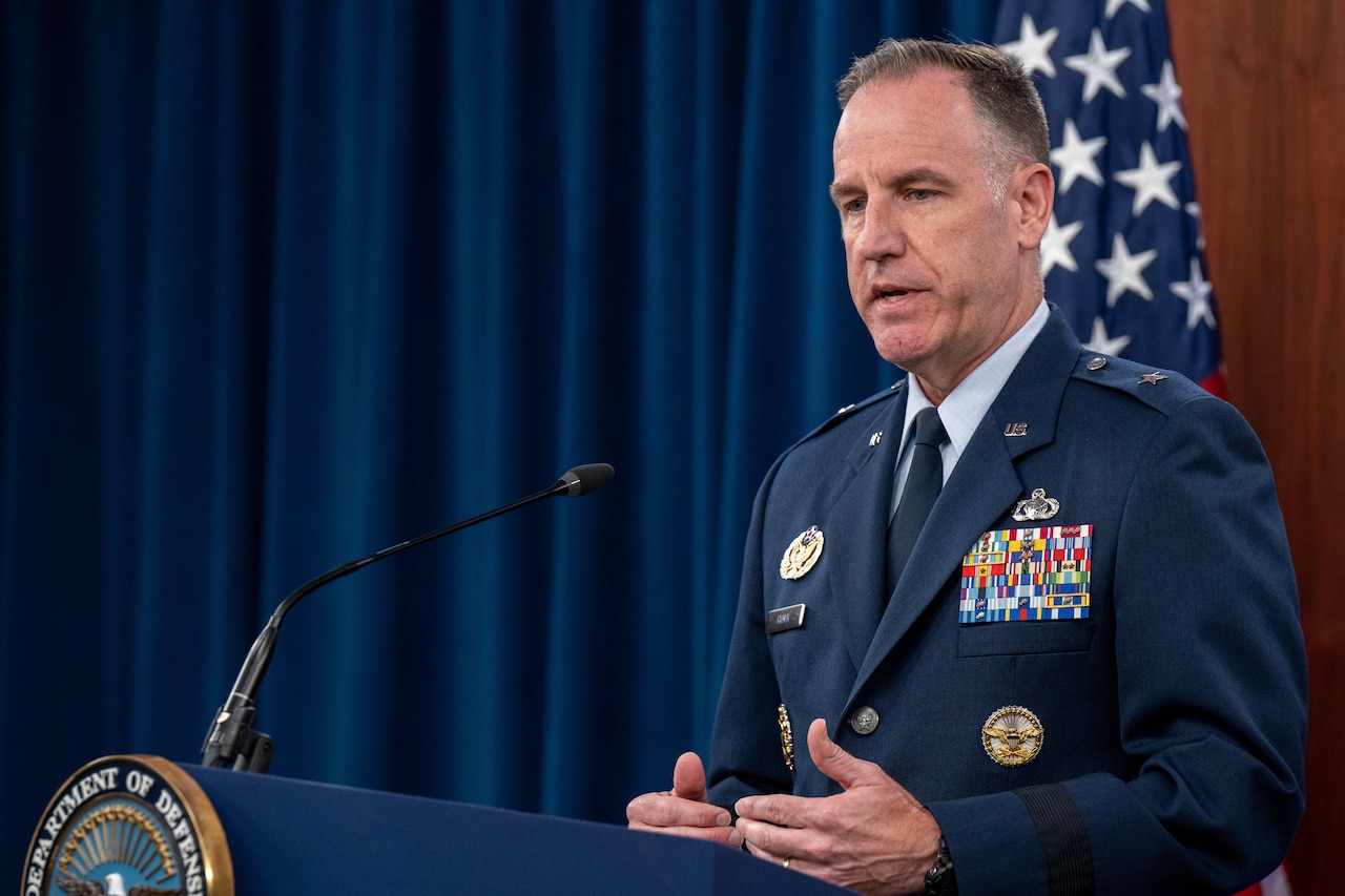Pentagon Press Secretary Air Force Brig. Gen. Pat Ryder speaks at a lectern.
