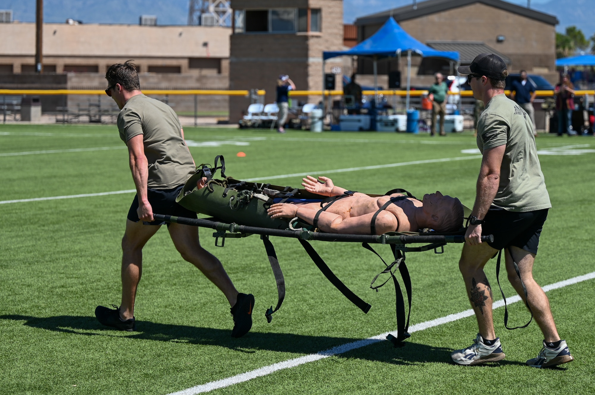 A photo of Airmen carrying a stretcher.