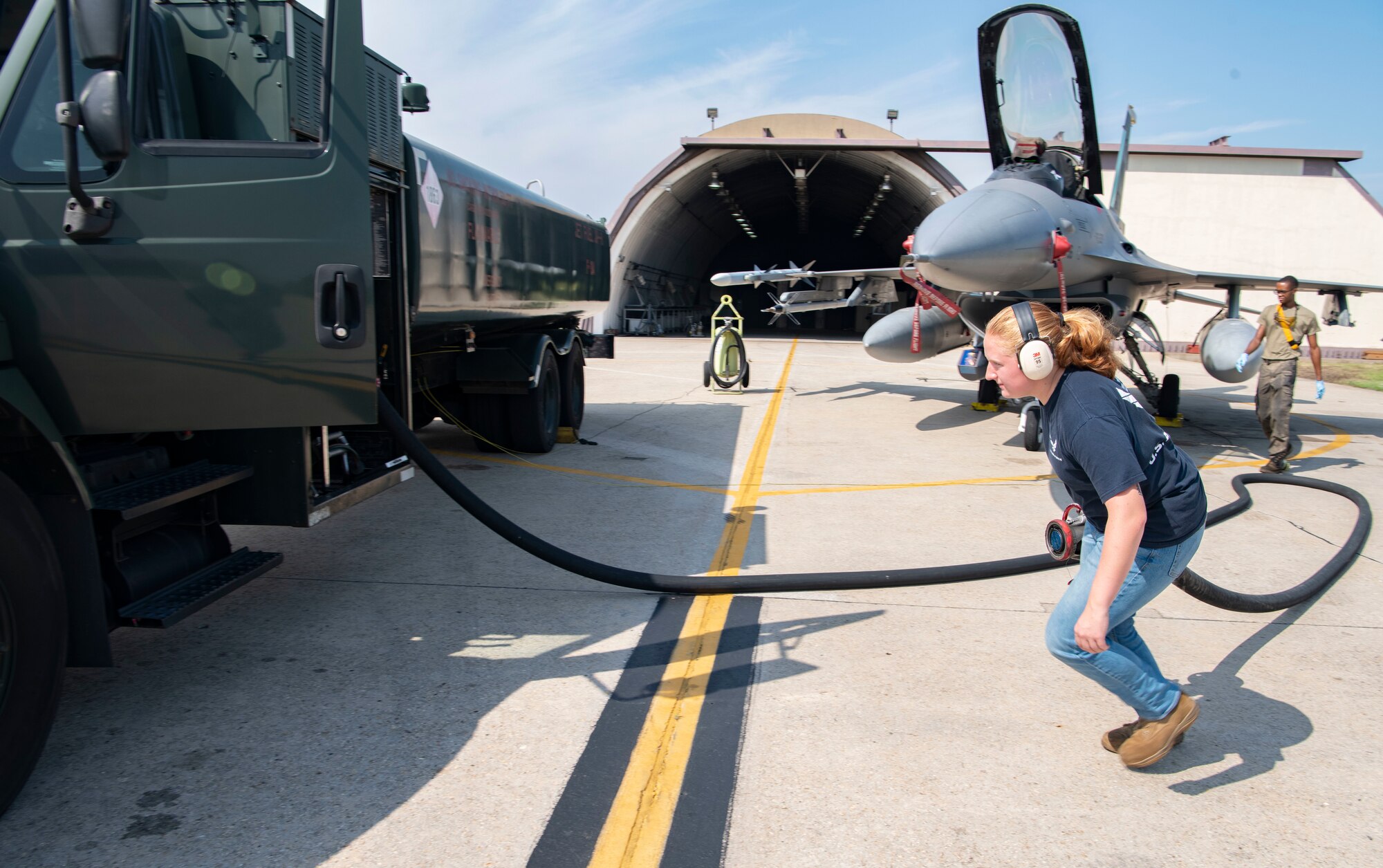 Airman 1st Class Maggie Bennett, 8th Logistics Readiness Squadron fuels distribution operator, retrieves a JP-8 fuel hose line at Kunsan Air Base, Republic of Korea, Aug. 26, 2022. The JP-8 fuel includes icing inhibitor additives which prevent the fuel from freezing during high altitude flights and when extreme cold weather is present. (U.S. Air Force photo by Staff Sgt. Sadie Colbert)