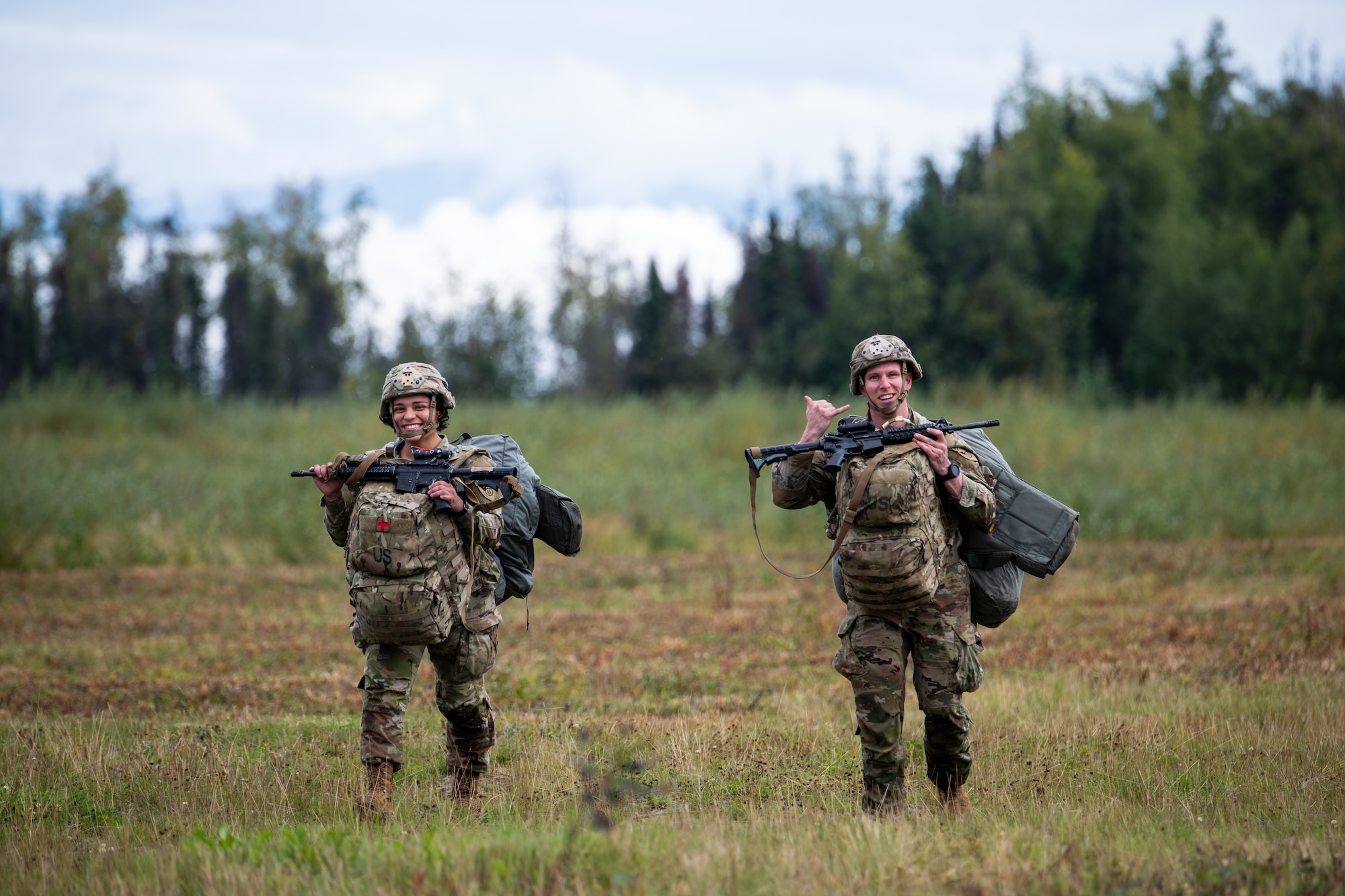 Soldiers smile after completing airborne operations.