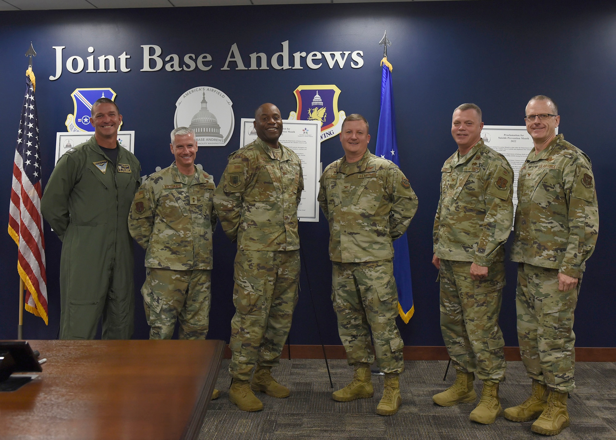 Joint Base Andrews senior leaders pose for a group photo following the signing of a Suicide Prevention Month proclamation at Joint Base Andrews, Md., Aug. 31, 2022. The group of leaders signed the proclamation as an annual recognition of September as the month to bring forth awareness and to educate our military community about suicide prevention. (U.S. Air Force photo by Airman 1st Class Austin Pate)