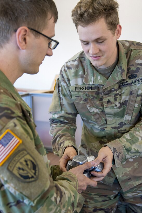 Sgts. Conrad Schneider and Jordan Preston, 398th Financial Management Support Center financial management technicians, prepare mock silver as injects for Diamond Saber at Joint Base McGuire-Dix, New Jersey, Aug. 13, 2022. Established in 2004, Diamond Saber is a U.S. Army Reserve-led exercise that trains and evaluates Soldiers and joint partners on warfighting functions such as funding the force, payment support, disbursing operations, accounting, fiscal stewardship, auditability and data analytics. (U.S. Army photo by Mark R. W. Orders-Woempner)