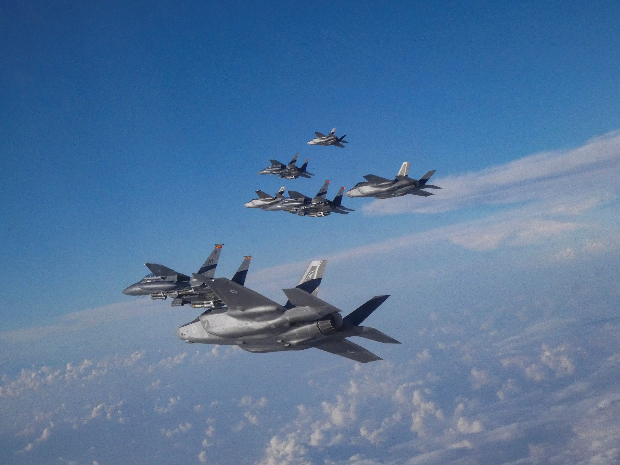 U.S. Air Force F-15E Strike Eagles and Israeli Air Force F-35 Lightening II fly in formation as part of a bilateral exercise in the U.S. Central Command area of responsibility, Nov. 29, 2022. (U.S. Air Force courtesy photo)