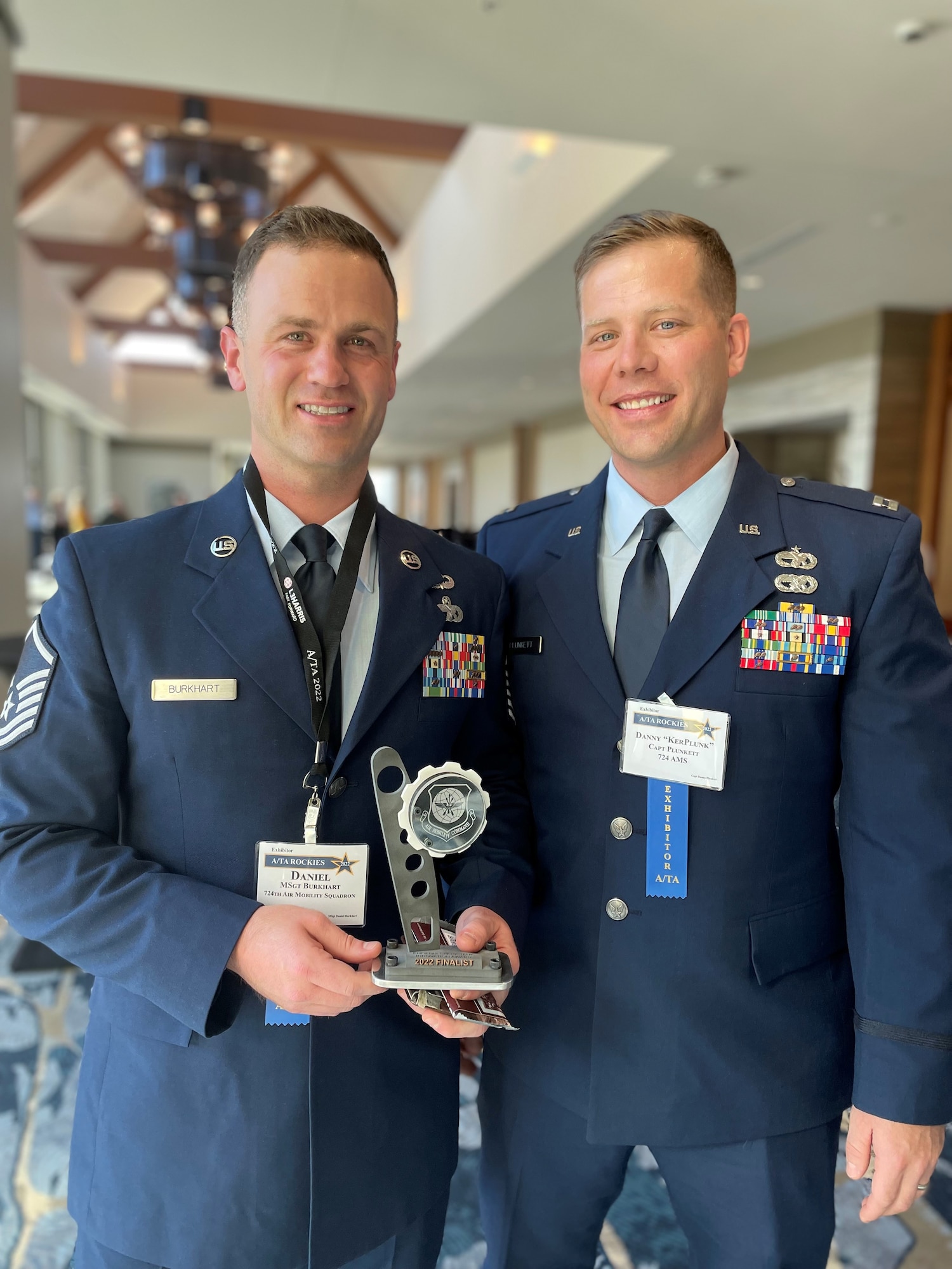 Capt. Danny Plunkett (right), operations flight commander, and Master Sgt. Daniel Burkhart, operations superintendent, both assigned to the 724th Air Mobility Squadron, pose for a photo during the Airlift/Tanker Association Symposium, Aurora, Colorado, Oct. 29, 2022.