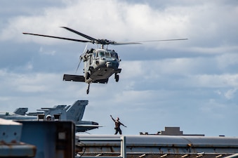 PHILIPPINE SEA (Nov. 27, 2022) An MH-60S Sea Hawk, attached to the Golden Falcons of Helicopter Sea Combat Squadron (HSC) 12, takes off from the flight deck of the U.S. Navy’s only forward-deployed aircraft carrier, USS Ronald Reagan (CVN 76), in the Philippine Sea.