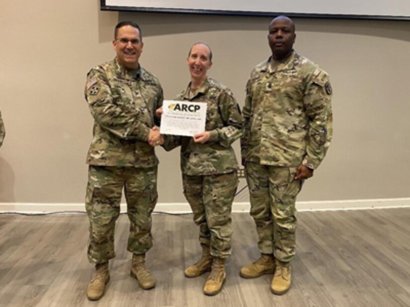 Colonel (Promotable) Roger Giraud presents the Soldier Recovery Unit of the Year Award to Fort Hood, at the annual Senior Leaders Summit Oct 27, 2022, Washington DC.