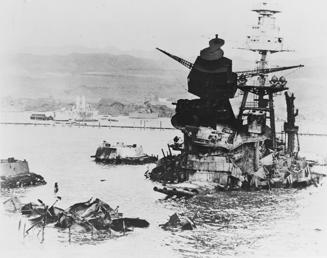 A half-sunk ship juts out of water.
