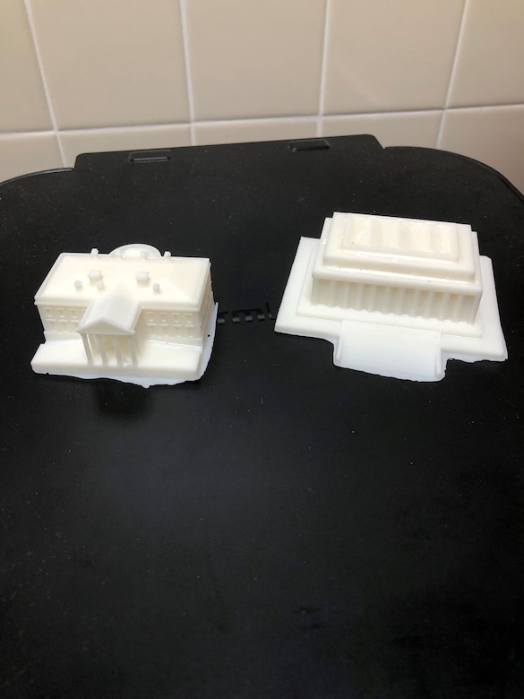 These 3D printed models of the White House and Lincoln Memorial rest on a table at the SparkX Cell Innovation and Idea Center at Joint Base Andrews, Md.