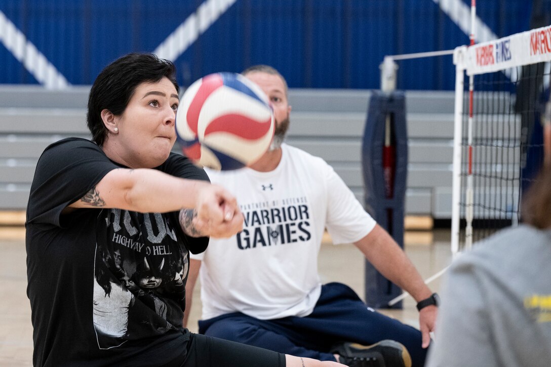 An RSM bumps a volleyball into the air.