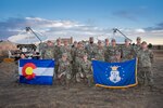 Members of the 138th Space Control Squadron, Colorado Air National Guard gather for a group photo at a forward operating base on Schriever Space Force Base, Colorado Springs, Colorado, Oct. 21, 2022. The Airmen of the 138th SPCS participated in the Neptune Falcon Exercise to test their capabilities in a contested multi-domain operation designed in preparation for real world space control missions. (U.S. Space Force Photo by Mr. Dennis Rogers)