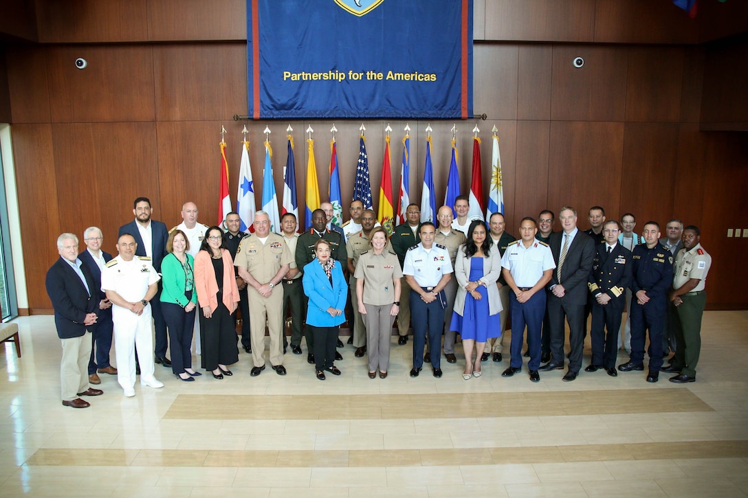 Senior leaders and representatives from the U.S. military, Western Hemisphere militaries, governments, non-governmental organizations (NGOs) and academia pose for a group photo at a ceremony commemorating the 25th anniversary of the command’s Human Rights Initiative (HRI).