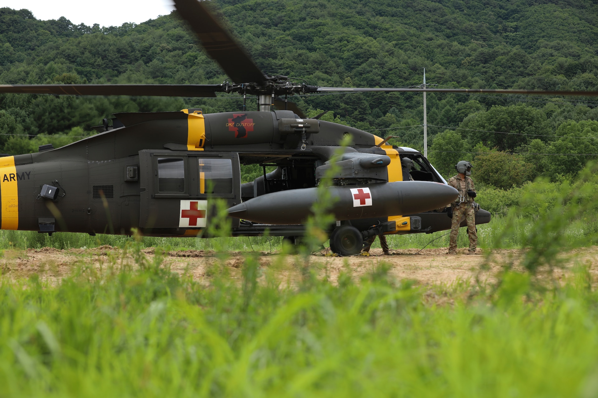 Spc. Prentice Urban, a UH-60 Helicopter Repairer and Crew Chief from Charlie Company, 3-2 General Support Aviation Battalion, 2nd Combat Aviation Brigade, 2nd Infantry Division, prepares his team's HH-60M MEDEVAC Helicopter for a training mission, September 1, 2022, Camp Humphreys, Republic of Korea. Urban's position as a crew chief is to assist the pilots during the flight ensuring proper operations. (U.S. Army photo by Sgt. Oscar Toscano)