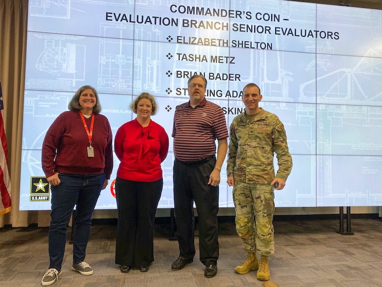 U.S. Army Corps of Engineers Galveston District Evaluation Branch's senior regulators receive the district commander's coin for going above and beyond to help onboard new members to the regulatory team. 

Honoring someone with a commander’s coin is a way for the district commander to show their appreciation for a phenomenal job, on the spot. More than just a ‘thank you’ or a pat on the back, the commander’s coin is something tangible to remember the occasion.