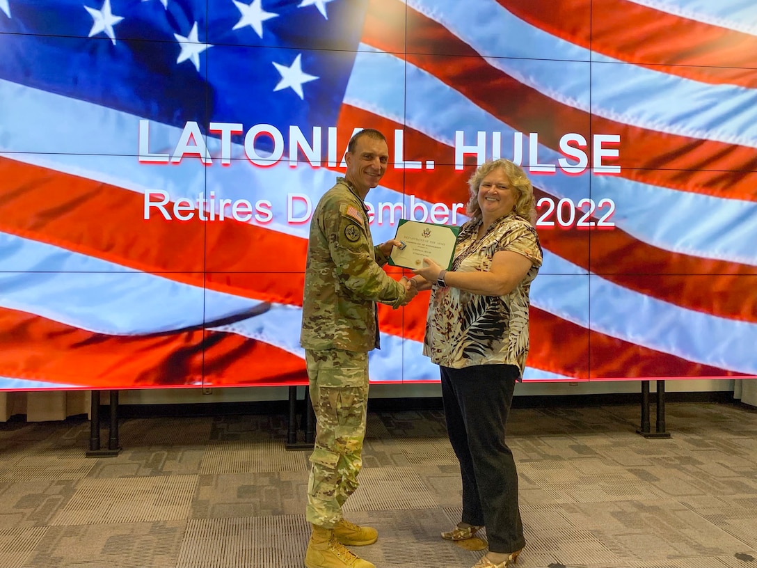 Latonia L. Hulse (right) receives the Army Civilian Service Commendation Medal from Col. Rhett Blackmon, U.S. Army Corps of Engineers Galveston District's commander. Hulse served 27 years of active-duty service in the U.S. Air Force and 11 years as a Department of Defense civilian employee