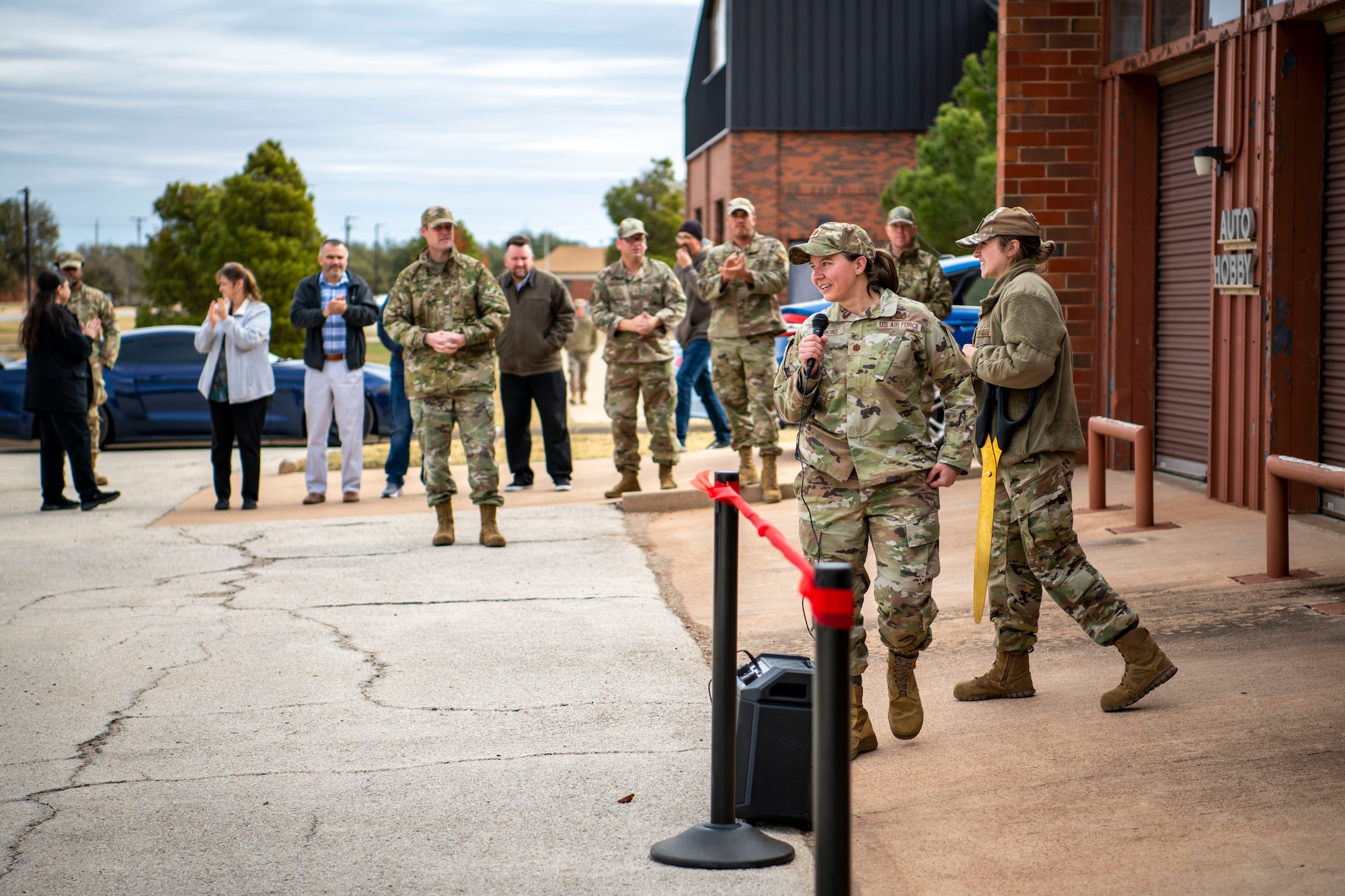 Keith Quinn, Outdoor Recreation manager, and 7th Bomb Wing leadership cut the ribbon during the grand opening ceremony for the Dyess Auto Hobby Shop at Dyess Air Force Base, Texas, Dec. 1, 2022. The Dyess Auto Hobby Shop is located at building 7101 and will be open Friday - Sunday from 12 p.m. - 6 p.m. (U.S. Air Force photo by Senior Airman Leon Redfern)