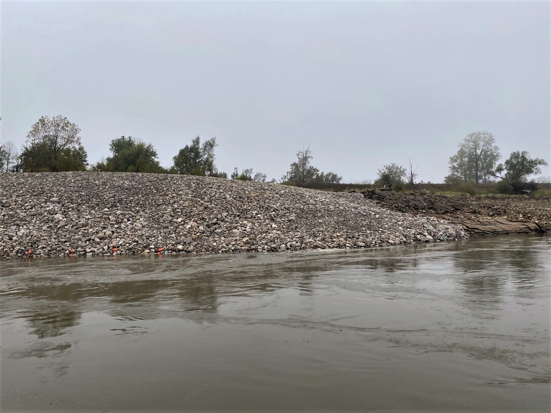 Congratulations to the Memphis District for recently completing a $6M Bipartisan Infrastructure Law (BIL)-funded project at Below Knowlton, Arkansas. 

“Work to complete revetment stone repairs began on Sep. 27, 2022,” Project Manager Zach Cook said. “Work was then completed ahead of the required completion date on Nov. 8, 2022, despite record low water conditions and stone delivery delays due to tow restrictions.” 

Contractor Luhr Bros., Inc. from Columbia, Illinois, executed the project work, which consisted of placing approximately 163,000 tons of Graded Stone C (400-pound maximum stone-size) to repair two bank failures. Repairing these banks ultimately restored them to stable slopes.