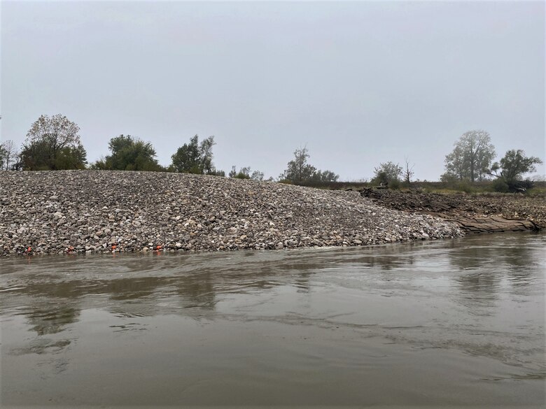 Congratulations to the Memphis District for recently completing a $6M Bipartisan Infrastructure Law (BIL)-funded project at Below Knowlton, Arkansas. 

“Work to complete revetment stone repairs began on Sep. 27, 2022,” Project Manager Zach Cook said. “Work was then completed ahead of the required completion date on Nov. 8, 2022, despite record low water conditions and stone delivery delays due to tow restrictions.” 

Contractor Luhr Bros., Inc. from Columbia, Illinois, executed the project work, which consisted of placing approximately 163,000 tons of Graded Stone C (400-pound maximum stone-size) to repair two bank failures. Repairing these banks ultimately restored them to stable slopes.
