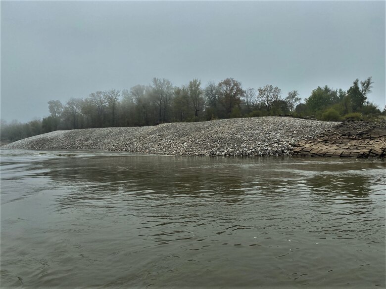 Congratulations to the Memphis District for recently completing a $6M Bipartisan Infrastructure Law (BIL)-funded project at Below Knowlton, Arkansas. 

“Work to complete revetment stone repairs began on Sep. 27, 2022,” Project Manager Zach Cook said. “Work was then completed ahead of the required completion date on Nov. 8, 2022, despite record low water conditions and stone delivery delays due to tow restrictions.” 

Contractor Luhr Bros., Inc. from Columbia, Illinois, executed the project work, which consisted of placing approximately 163,000 tons of Graded Stone C (400-pound maximum stone-size) to repair two bank failures. Repairing these banks ultimately restored them to stable slopes.