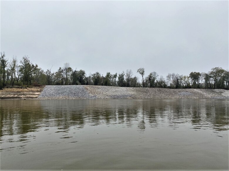 Congratulations to the Memphis District for recently completing a $6M Bipartisan Infrastructure Law (BIL)-funded project at Below Knowlton, Arkansas. 

“Work to complete revetment stone repairs began on Sep. 27, 2022,” Project Manager Zach Cook said. “Work was then completed ahead of the required completion date on Nov. 8, 2022, despite record low water conditions and stone delivery delays due to tow restrictions.” 

Contractor Luhr Bros., Inc. from Columbia, Illinois, executed the project work, which consisted of placing approximately 163,000 tons of Graded Stone C (400-pound maximum stone-size) to repair two bank failures. Repairing these banks ultimately restored them to stable slopes.