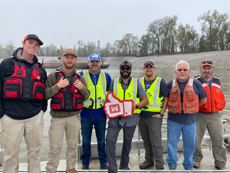 Congratulations to the Memphis District for recently completing a $6M Bipartisan Infrastructure Law (BIL)-funded project at Below Knowlton, Arkansas. 

“Work to complete revetment stone repairs began on Sep. 27, 2022,” Project Manager Zach Cook said. “Work was then completed ahead of the required completion date on Nov. 8, 2022, despite record low water conditions and stone delivery delays due to tow restrictions.” 

Contractor Luhr Bros., Inc. from Columbia, Illinois, executed the project work, which consisted of placing approximately 163,000 tons of Graded Stone C (400-pound maximum stone-size) to repair two bank failures. Repairing these banks ultimately restored them to stable slopes.