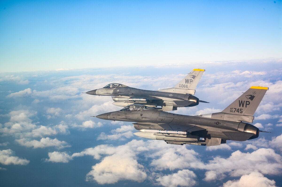 A two-ship of 8th Operations Group F-16 Fighting Falcons fly during a training event in the skies near Kunsan Air Base, Republic of Korea, Dec. 1, 2022. During the training, pilots from the 35th and 80th Fighter Squadrons executed quick-response tactics, honing their jet fighting capabilities to support a free and open Indo-Pacific theater. (U.S. Air Force photo by Staff Sgt. Sadie Colbert)