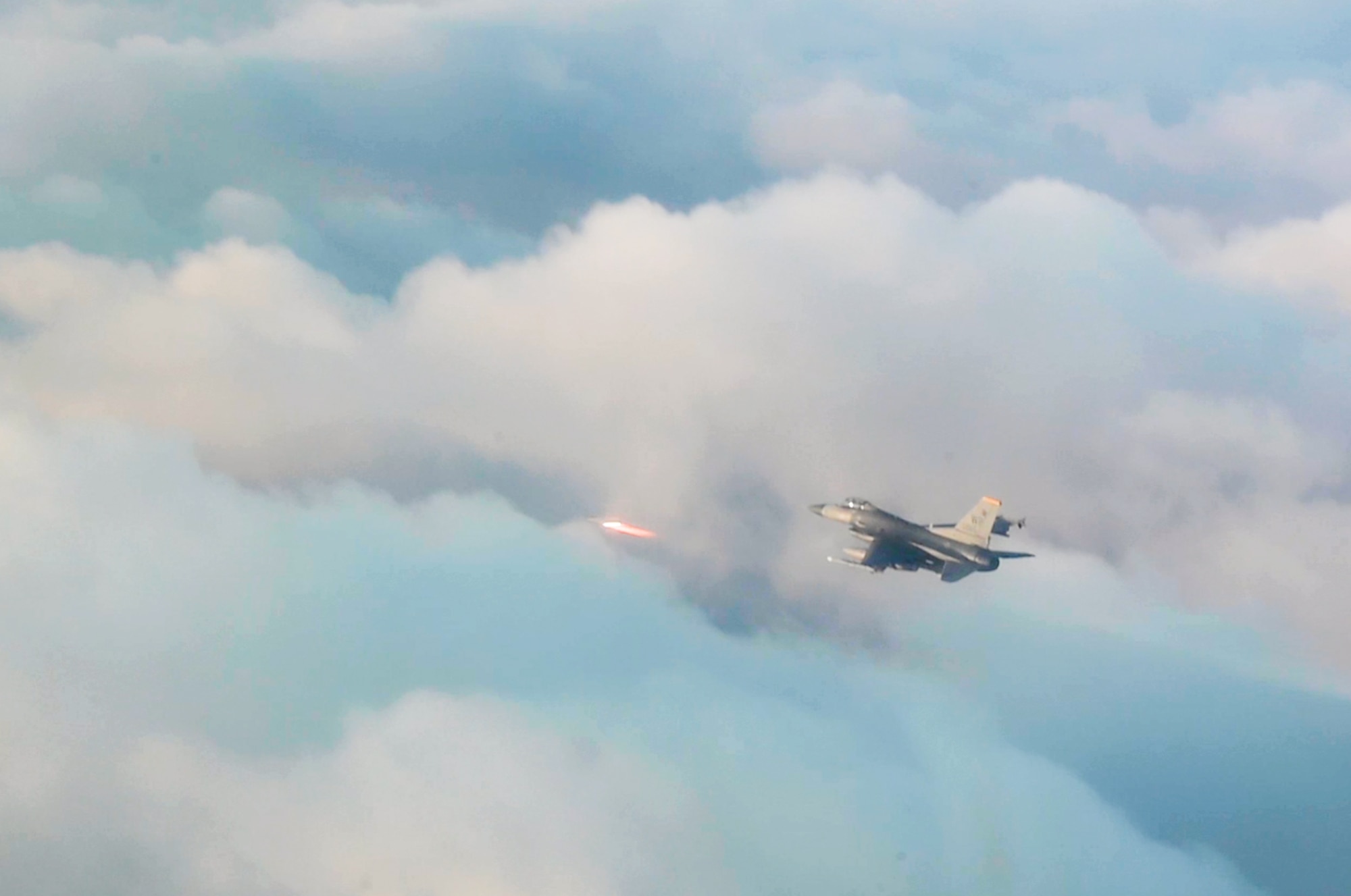 An 8th Operations Group F-16 Fighting Falcon fires an AIM-9 missile at a simulated adversary during a training in the skies near Kunsan Air Base, Republic of Korea, Dec. 1, 2022. Kunsan, along with many other military installations, have a ‘fight tonight’ stance, ensuring they can quickly deploy aircraft to combat adversaries in the Indo-Pacific region at a moment’s notice. (U.S. Air Force photo by Staff Sgt. Sadie Colbert)